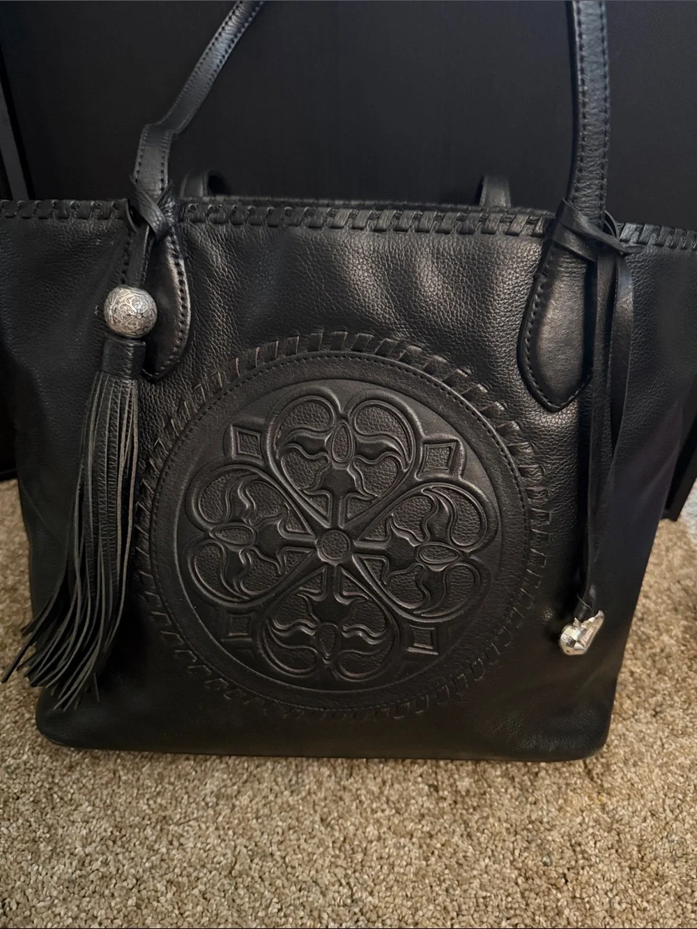 Brighton Black Leather Tote with Embossed Medallion and Tassel